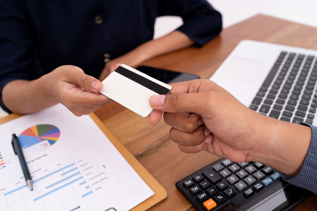 Close up Business Transactions with His Credit Card to a Customer Service.